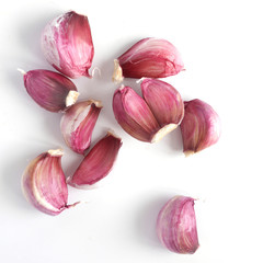 Pink garlic isolated on white background, top view.