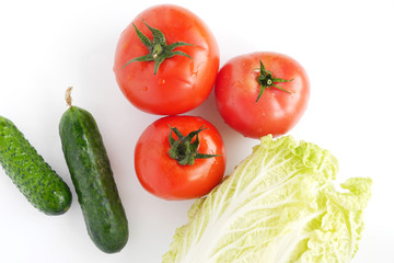 Vegetables isolated on white background (Pekinese cabbage, tomato, cucumber), top view.