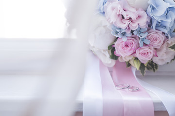 Wedding rings and bridal bouquet