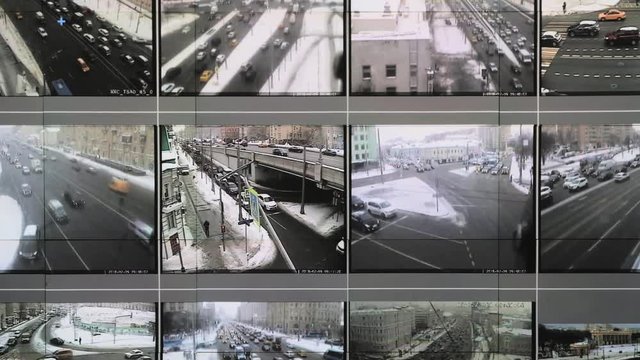 Screens in the analytical center show data from traffic cameras in the city