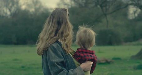 Mother in forest with her toddler son