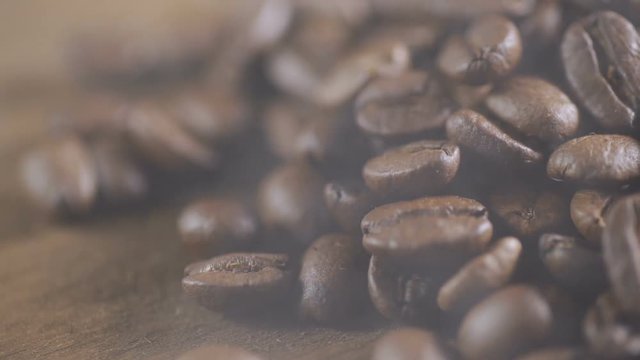 Fried coffee beans, delicious aroma, covered with smoke, roasted grain cafe flavor taste hot fresh smell morning.