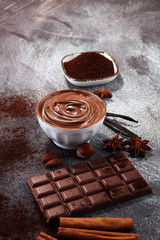 Chocolate bars on table with chocolate powder.