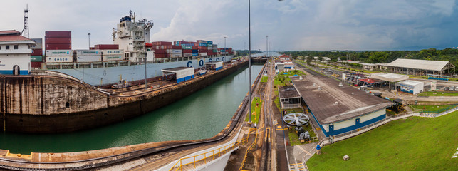 GATUN, PANAMA - MAY 29, 2016: Container ship Cosco Boston is passing through Gatun Locks, part of...