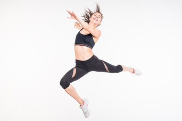 Fototapeta na wymiar Sporting girl is engaged in fitness on a white background