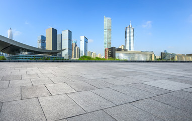 Empty square floor and modern city commercial architecture panorama in shenzhen,China