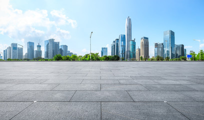 Empty square floor and modern city commercial architecture panorama in shenzhen,China