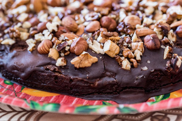 Close up homemade chocolate cake with walnuts