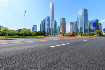 Fototapeta na wymiar Empty asphalt road and modern city commercial buildings in Shenzhen,China