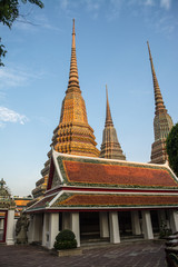 Fototapeta premium Pagoda is in Wat Pho that was named as the temple of the pagoda or chedi that are decorated with yellow glaze or glazed tiles or dark blue. 
