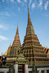 Fototapeta premium Pagoda is in Wat Pho that was named as the temple of the pagoda or chedi that are decorated with yellow glaze or glazed tiles or dark blue. 