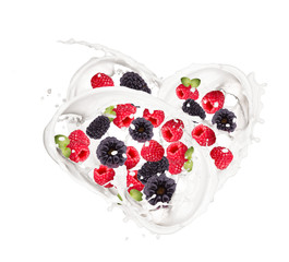 Milk splash with berries isolated on white background. 