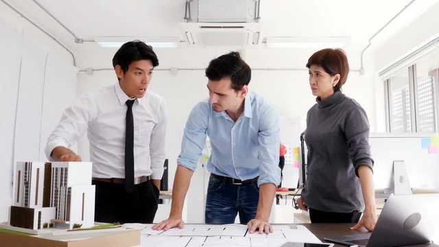 People discuss about building project and disagree with each other. People working with serious emotion.