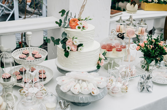 Two-tier wedding cake and Cake pops at a wedding
