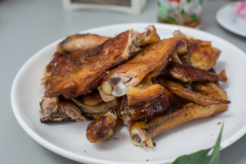 roasted chicken on wooden table,