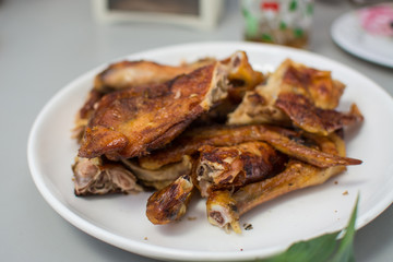 roasted chicken on wooden table,