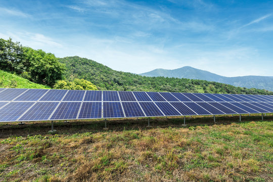 Solar panels and mountains landscape