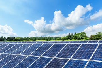 Solar panels and blue sky with white clouds