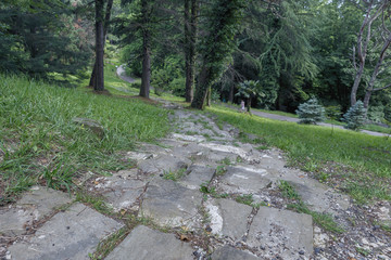 walking trail with stone steps in the city park, close-up