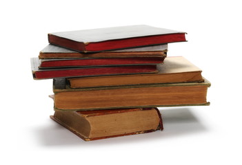 Stack of old antique big books isolated on white background