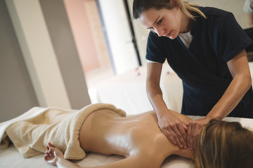 Professional masseur working on client