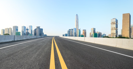 Fototapeta premium Empty asphalt road and modern city skyline panorama in Shenzhen,China