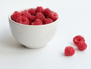 Raspberries in white bowl