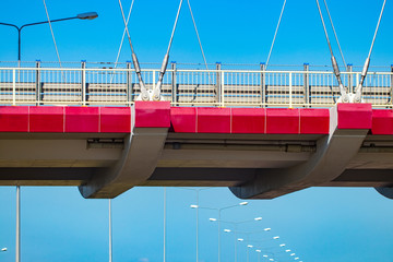 Highway interchange with bridge and sun on the background