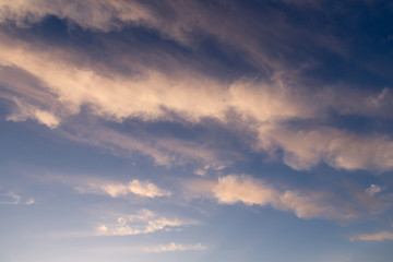 pink clouds highlighted by sunset, long clouds color gradient, abstract