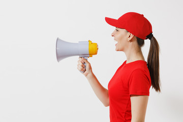 Delivery woman in red uniform isolated on white background. Female courier in cap, t-shirt screaming in megaphone hot news. Fun girl announces discounts sale. Copy space for advertisement. Side view.