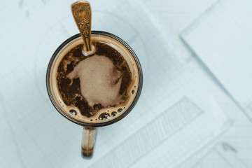 mug on the table with papers