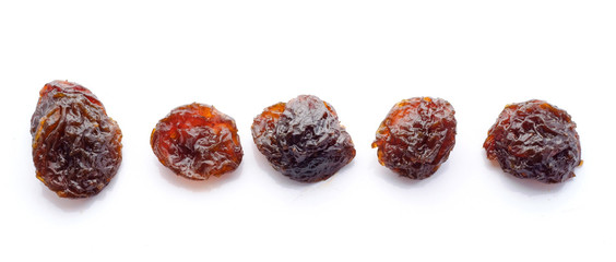 Raisins on white background