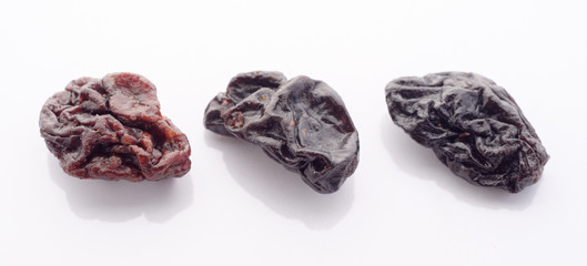 Raisins on white background