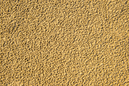 Sand of a beach with rain holes