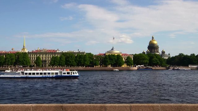 Tourist boat passing the historic cityscape of Saint Petersburg Russia