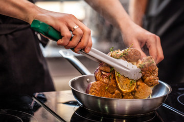 oncept of the correct cooking of meat. The chef prepares, fries a steak of mutton, pork or veal in...