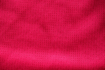 Red fabric sport clothing football jersey with air mesh texture background