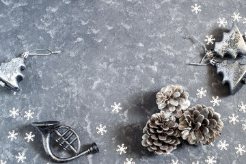 Christmas background with vintage silver Christmas toys and cones