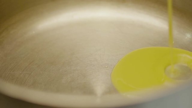Close-up Of A Stainless Steel Pan Is Poured Into A Fruit Berry Yellow Syrup For Brewing A Kissel. Restaurant Menu Dessert