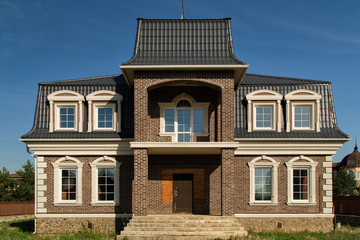 New Houses. Luxury Houses After Construction.Wooden Brick Houses. House Exterior. Life Concept
