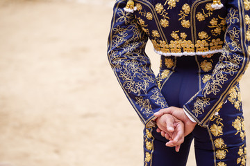 Bullfighter's hands and dress