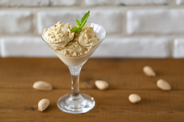 Homemade ice cream with almonds and mint
