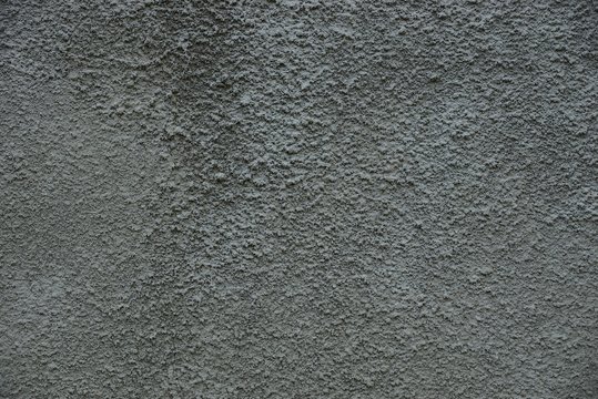gray stone texture from a part of a concrete wall of a building