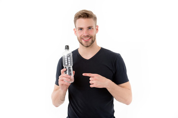Macho point finger at water bottle isolated on white. Happy man smile with plastic bottle. Thirst...
