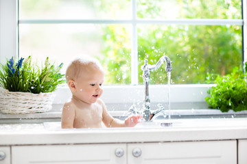 Little baby taking bath