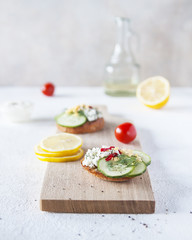 Top view of Healthy Sandwich toast with lettuce, ham, cheese and tomato on a wooden background