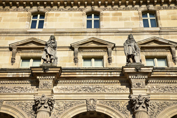 Fototapeta na wymiar Statues de Molière et Boileau au palais du Louvre à Paris, France