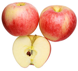Three red ripe apples; one cut in half; isolated on white background