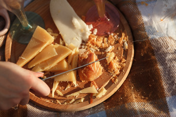 cut cheese on wooden plate