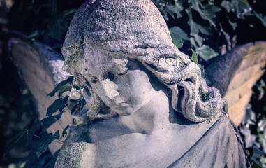Vintage image of a sad angel  (religion, faith, death, resurrection, eternity concept)